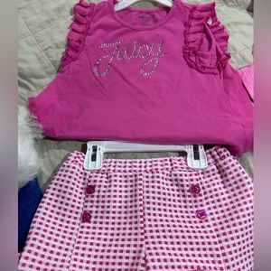Juicy Size 6x Girls Juicy Couture outfit.  Pink shirt with ruffles & chk shorts